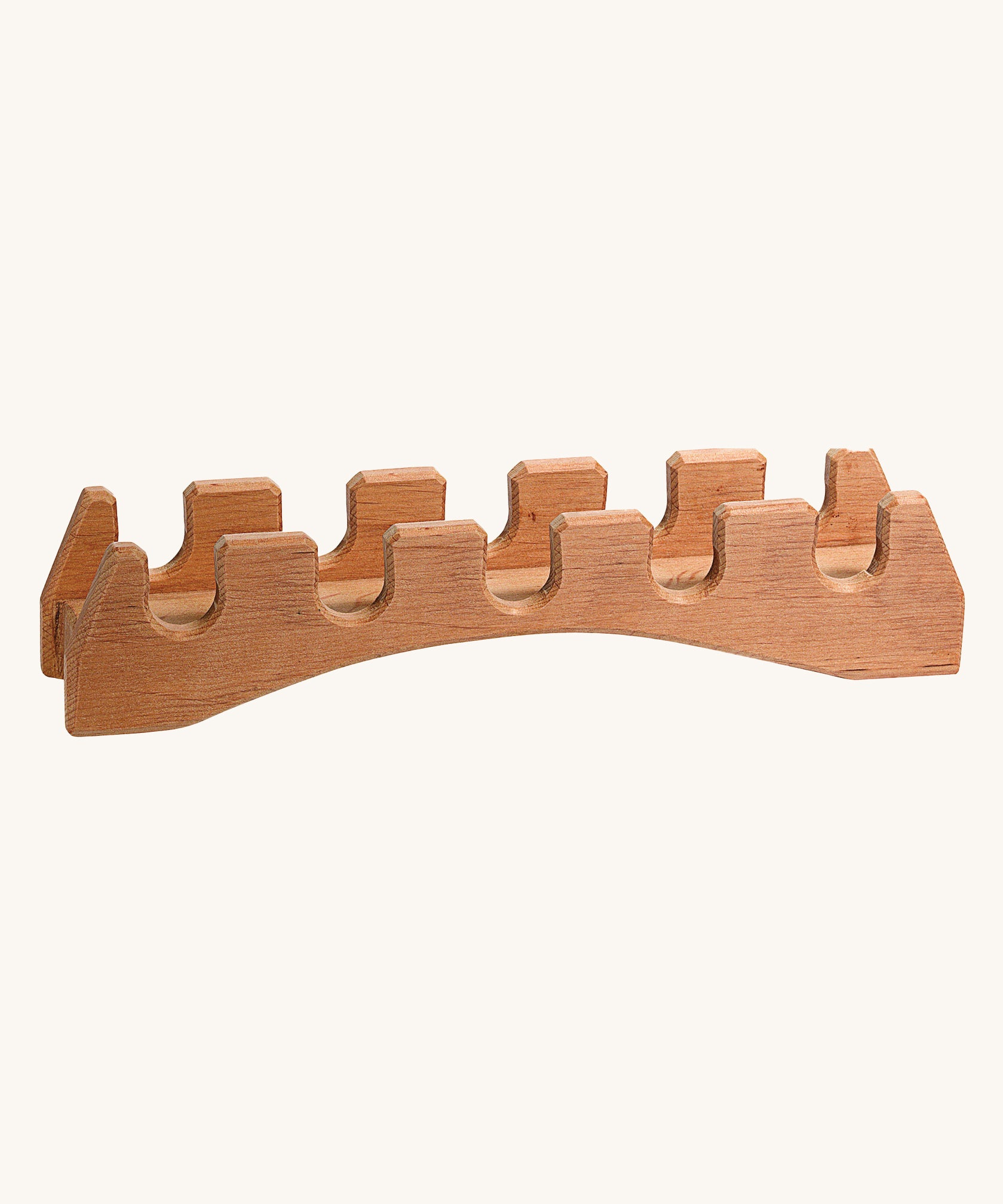 Ostheimer wooden castle toy bridge on a beige background. Hand made and showing the natural wood grain of the toy