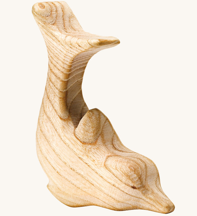 A beautifully hand crafted dolphin figure, showing the natural wood grain through out the toy