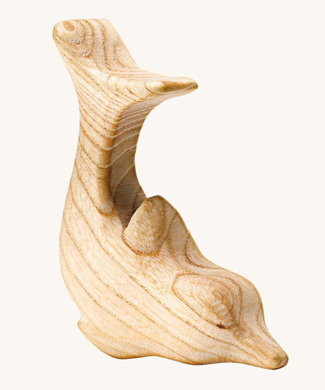 A beautifully hand crafted dolphin figure, showing the natural wood grain through out the toy