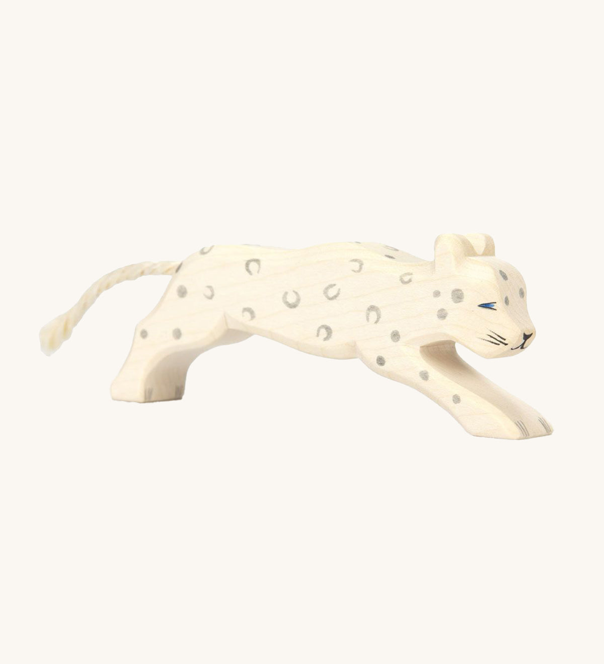 A beautifully hand crafted and hand painted Snow Leopard toy, in white with grey spots, blue eyes and a cord tail