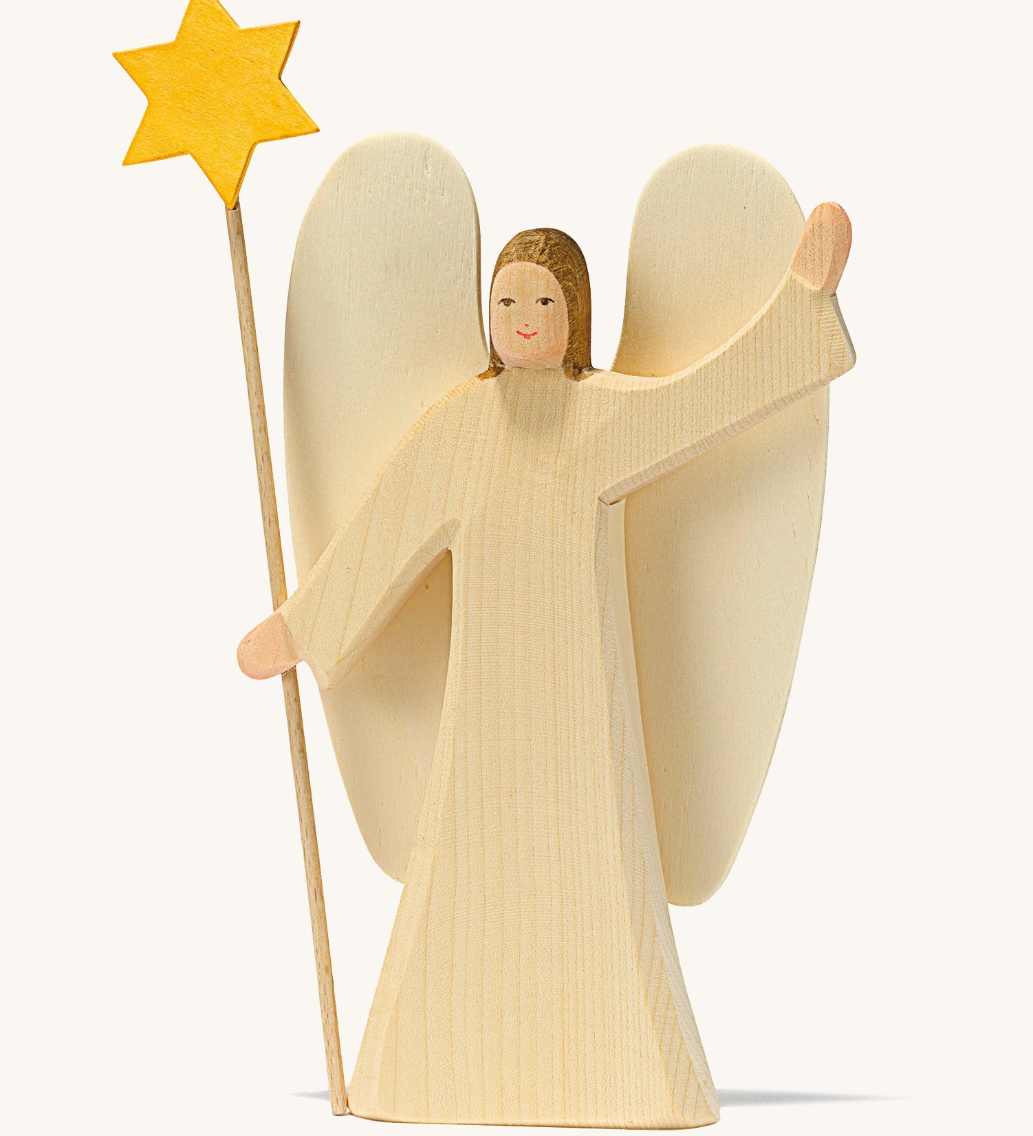 A wooden Ostheimer angel wearing a white gown holding a Ostheimer wooden star on a cream background