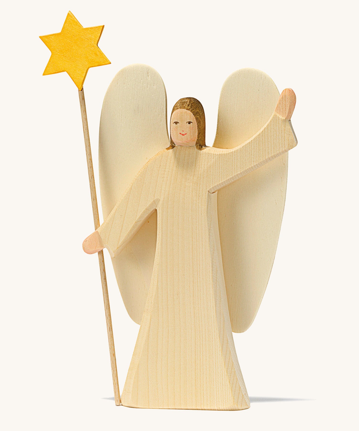 A wooden Ostheimer angel wearing a white gown holding a Ostheimer wooden star on a cream background