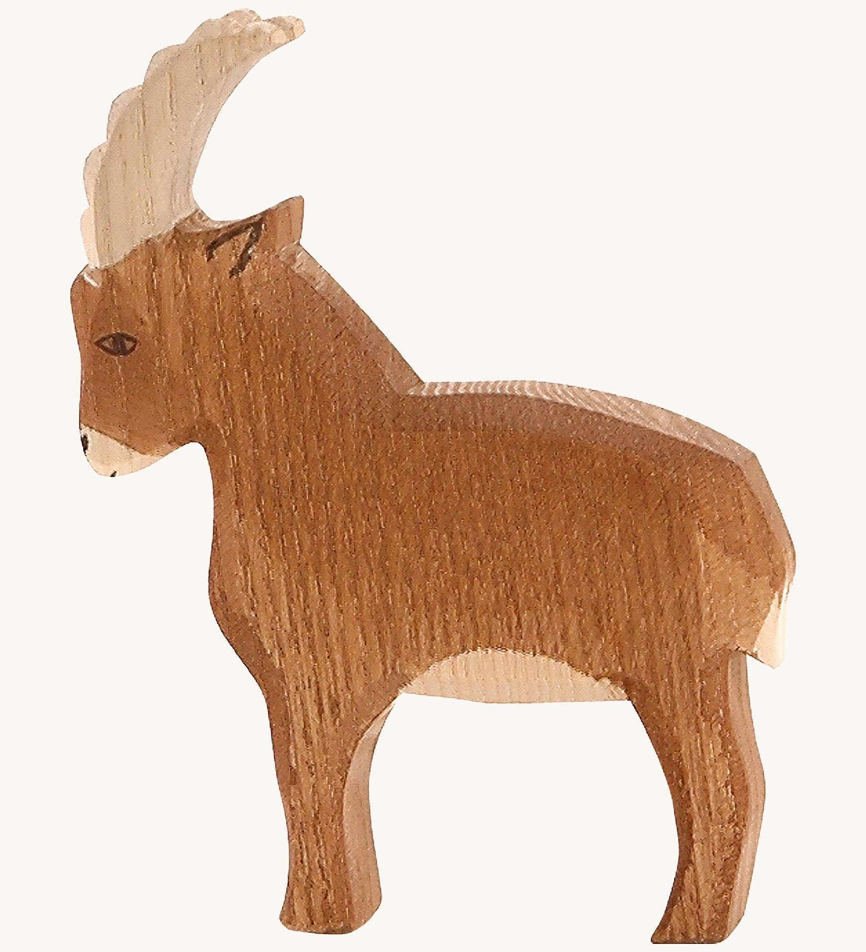 A brown wooden Ostheimer mountain goat on a cream background.