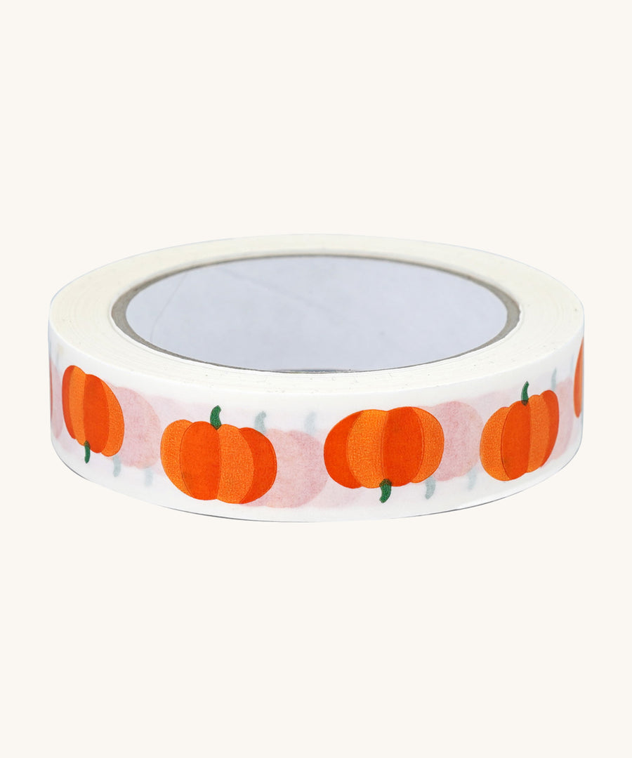 Babipur Pumpkin Eco Paper Tape in white, with orange pumpkin repeat pattern. On a cream background