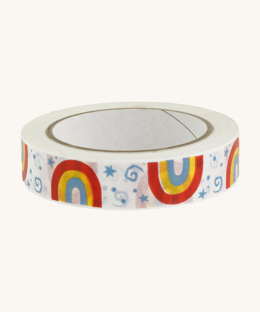 Paper tape with rainbows and stars on a cream background.