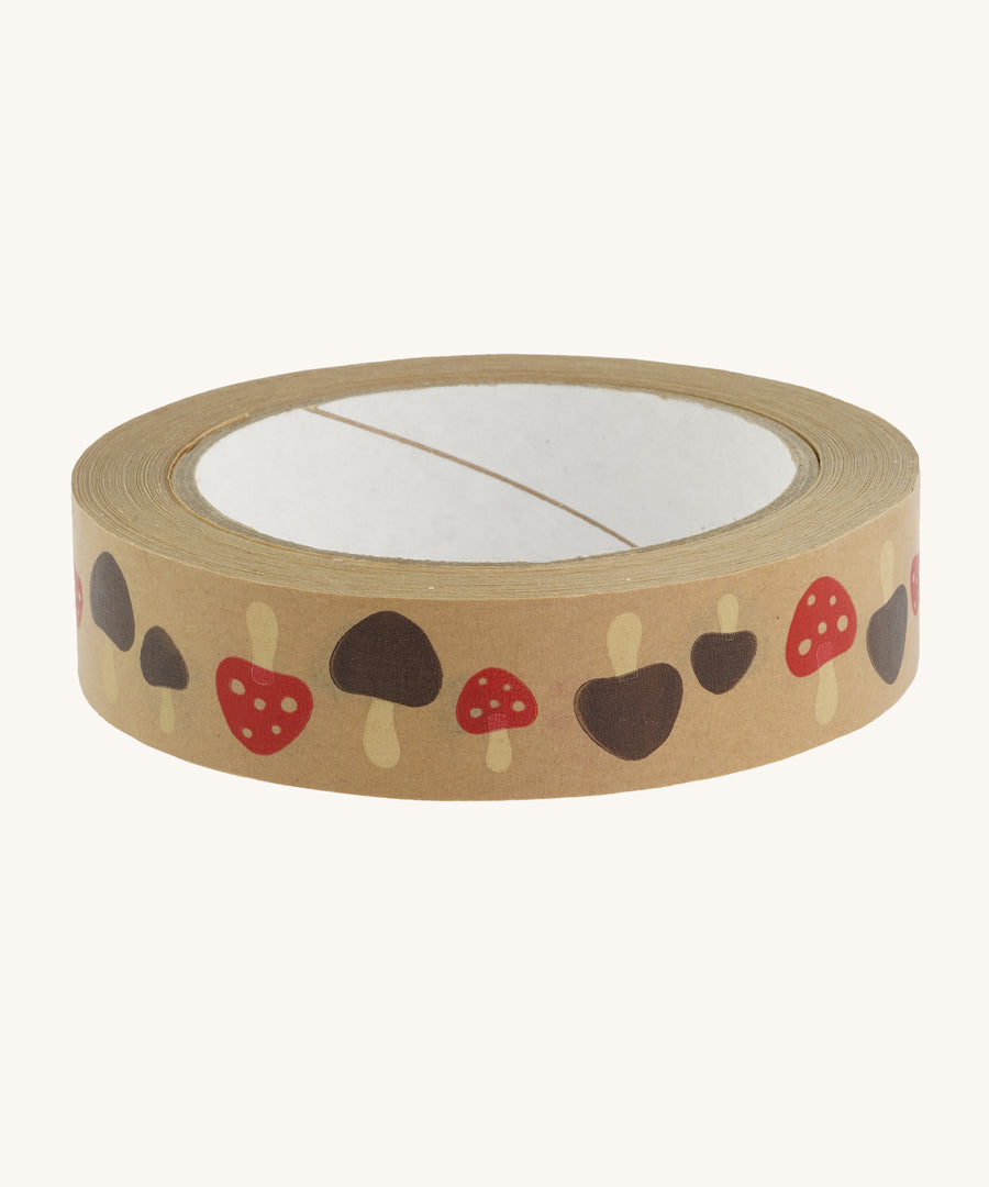 Brown paper tape with toadstool pattern on cream background.