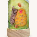 The Pasen Easter illustration by Het Wol Feetje sat in a Toverlux Magic Lantern base, on a cream background