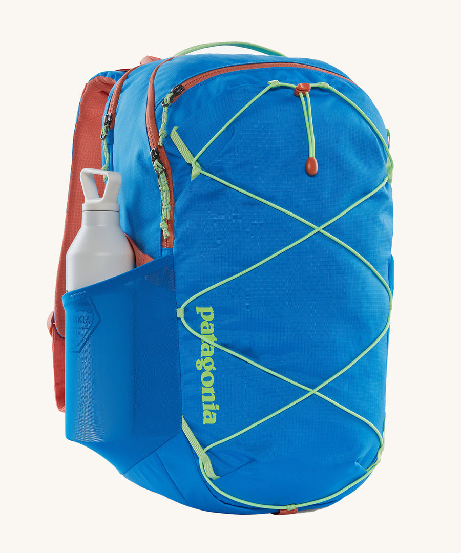 A Patagonia Refugio Day Pack 30L with a water bottle in the side mesh pocket