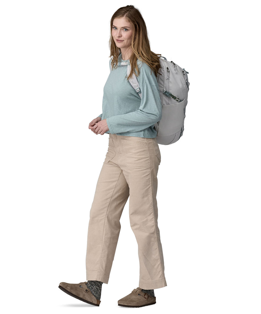 A person wearing the Patagonia Refugio Day Pack 30L Crisp Grey