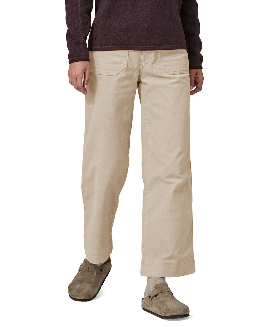 A person wearing the Patagonia Women's Wide Leg Cord Pants - Pumice, showing the flared style cut of the trouser legs