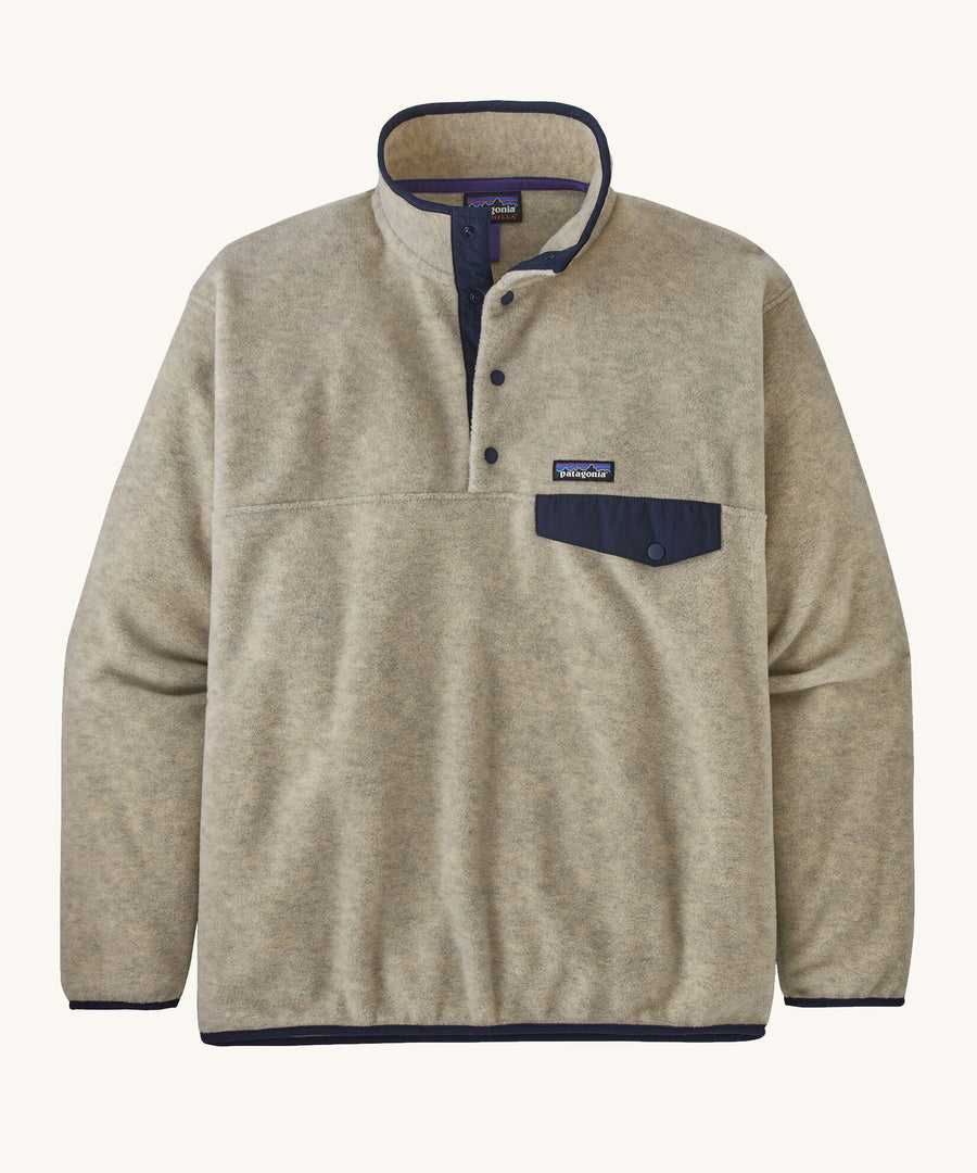 Patagonia Men's Synchilla Snap-T Fleece - Oatmeal Heather. A cream oatmeal coloured fleece with navy blue pocket flap, buttons and piping