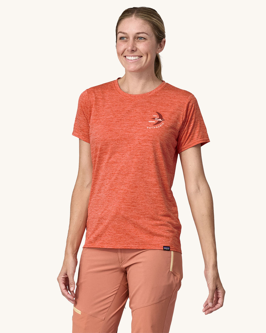 An adult wearing a Patagonia Women's Cap Cool Daily Graphic Shirt, showing the fit of the top from the front.