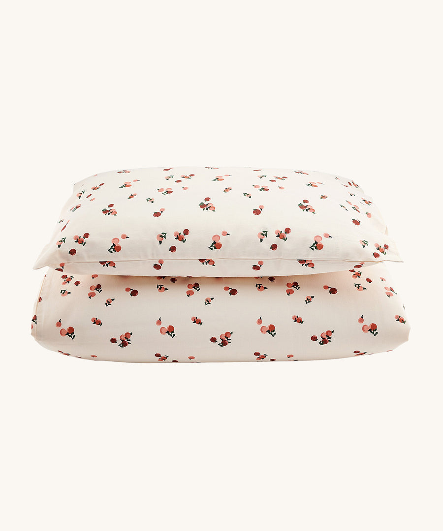 Avery Row Organic Cotton Bedding Set - Cotbed. A lovely Peach print on a cream fabric