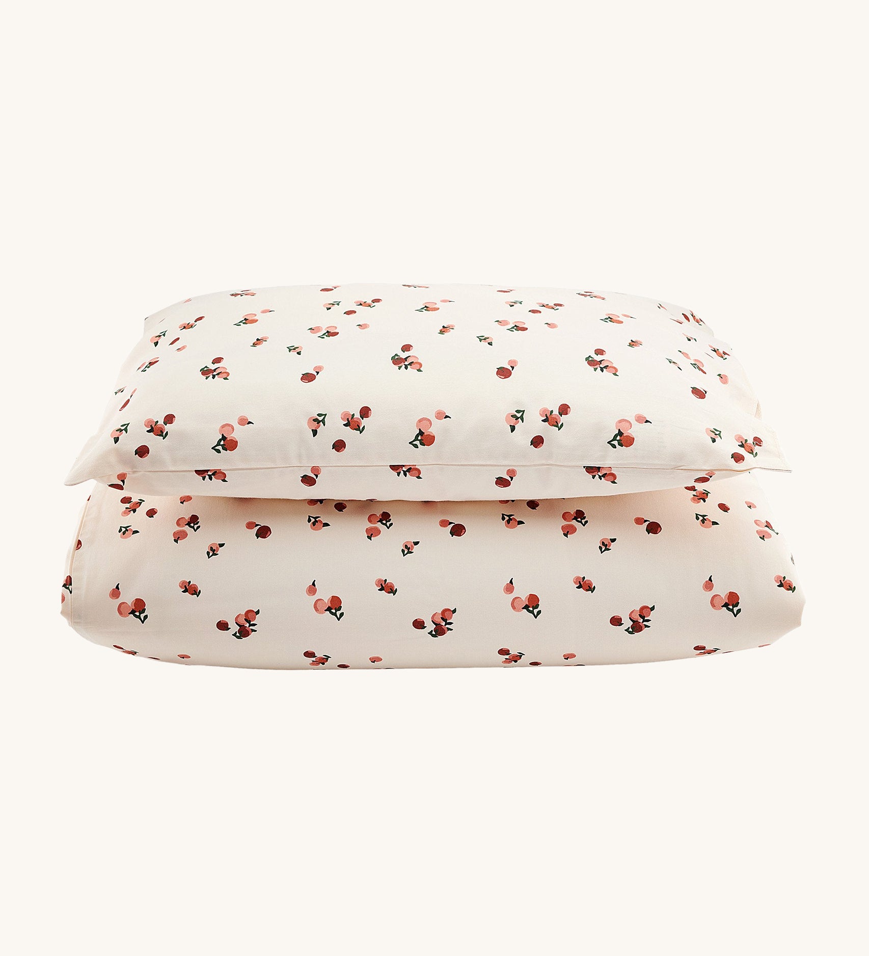 Avery Row Organic Cotton Bedding Set - Cotbed. A lovely Peach print on a cream fabric