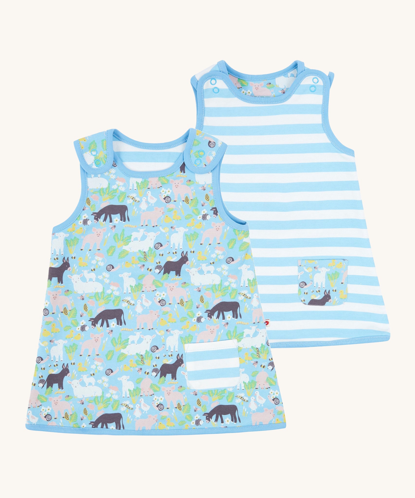 Piccalilly Country Friends Reversible Dress. One side is farm yard animals with a blue and white stripe pocket, the other is blue and white stripes with a farm yard animal print pocket