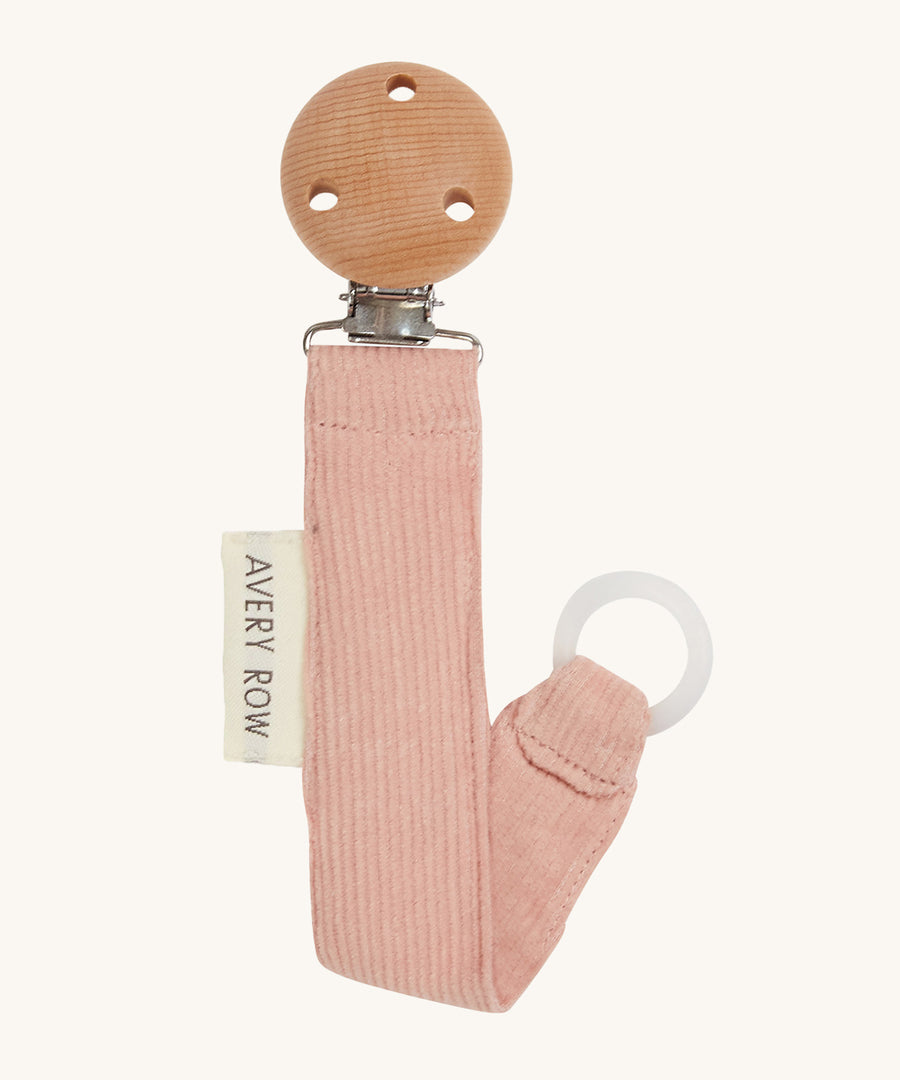 Avery Row Pacifier Holder - Pink, showing the silicone ring and wooden clip