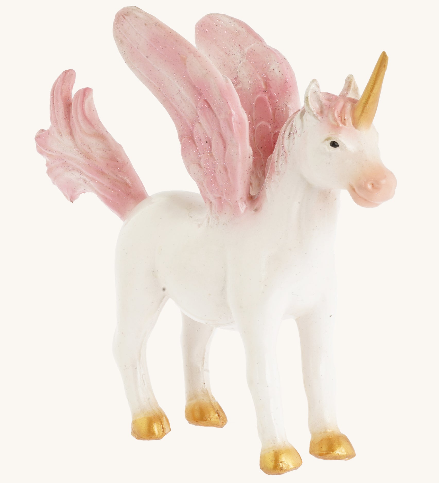 A closer look at the The Green Rubber Toys Rainbow Pegasus with a white body and pink details on the wings, tails and mane and golden hooves and horn.