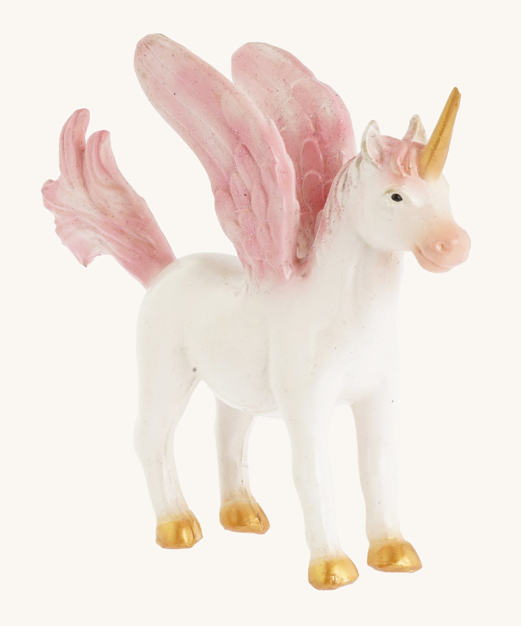 A closer look at the The Green Rubber Toys Rainbow Pegasus with a white body and pink details on the wings, tails and mane and golden hooves and horn.