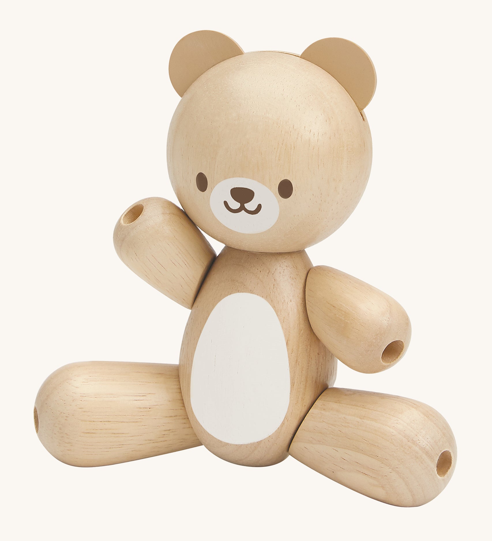 This PlanToys Bear is a sweet wooden toy that will be loved by babies and toddlers. This wooden baby toy bear has legs and arms that move around, a white tummy patch and a happy and smiling face. The image is on a cream background