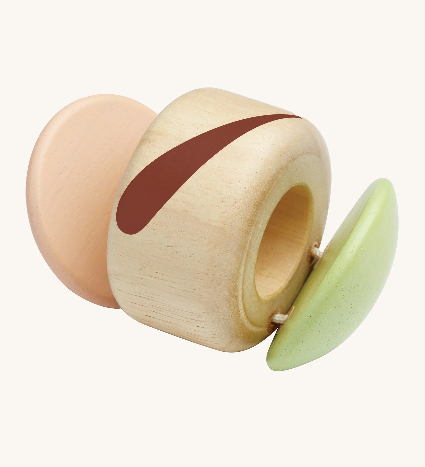 The PlanToys plastic-free, wooden clapping roller toy is a fun, sensory toy for babies and little ones. The clapper sides are in a soft pink and soft green colour, an the middle is natural wood with a brown stripe. The image is on a cream background.