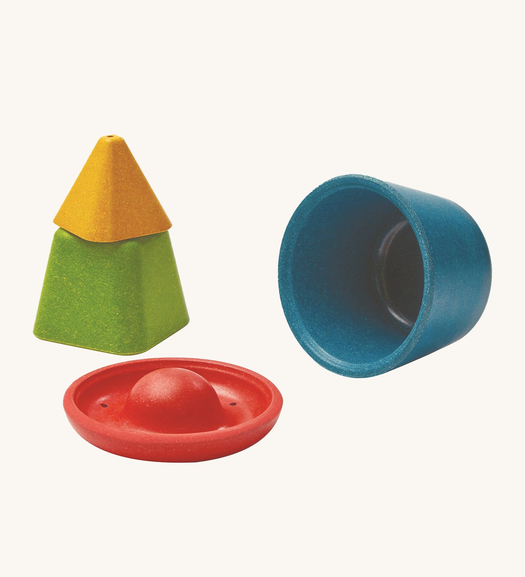 PlanToys Creative Sand Play set comes with 4 PlanWood pieces which are a yellow trianlge block, a green square block, a red disk block and a blue bowl block. Each block is hollow to all for sand or messy play building, or collecting treasures. The red and yellow piece have holes to allow for water to be poured through.