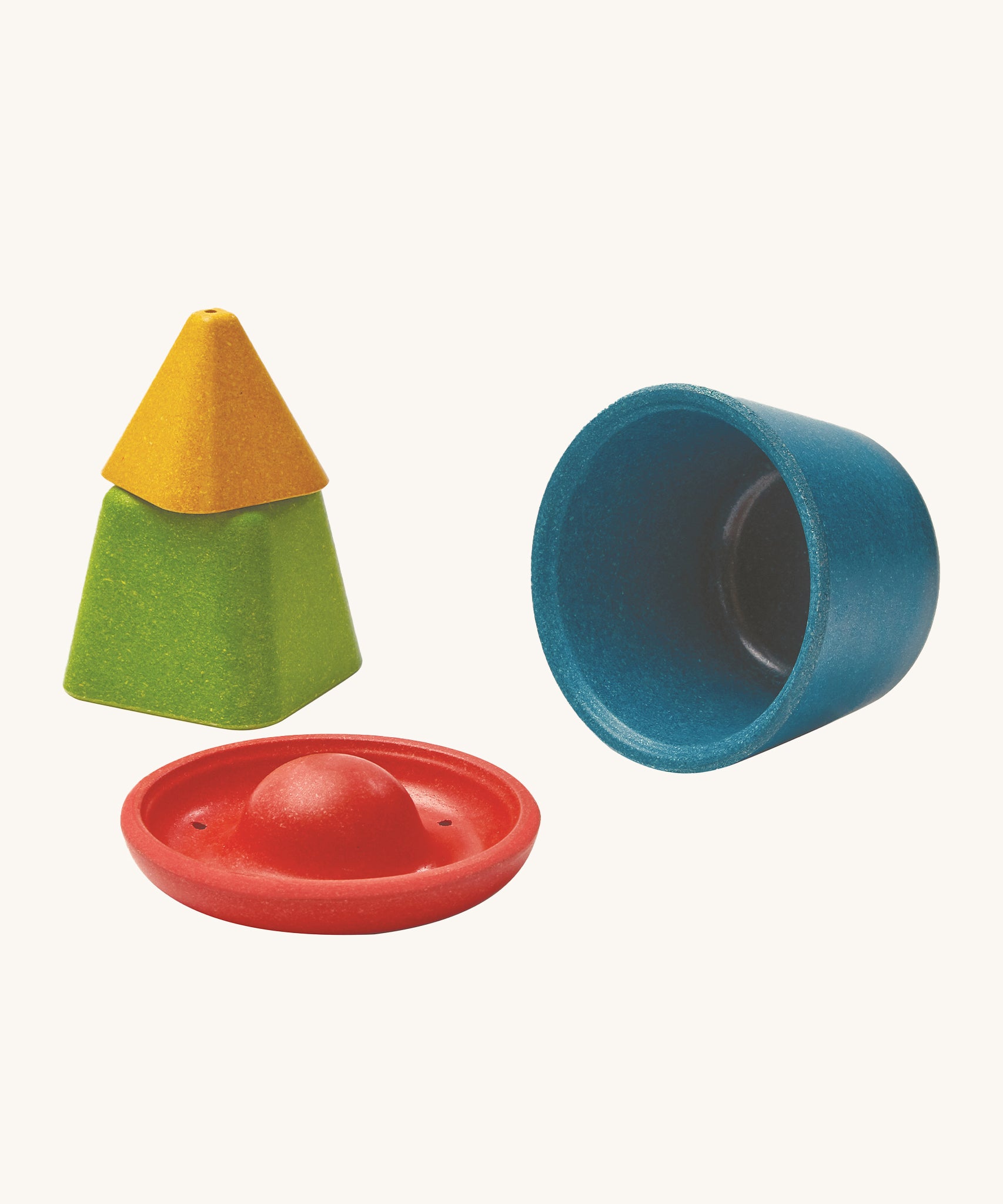 PlanToys Creative Sand Play set comes with 4 PlanWood pieces which are a yellow trianlge block, a green square block, a red disk block and a blue bowl block. Each block is hollow to all for sand or messy play building, or collecting treasures. The red and yellow piece have holes to allow for water to be poured through.