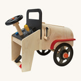 A side view of the PlanToys Motor Mechanic, showing the wheels which are removable for an interactive and imaginative play time, on a cream background