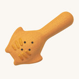 The back of the yellow scoop from the PlanToys Sand Play set. The scoop has small holes for water to pass through, and raised lines on the back. The scooper looks like  Mantaray from the ocean