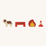 The wooden figures included in the PlanToys Fire Station, a dog, a safety bollard, a fire/flame and a safety cone on a cream background