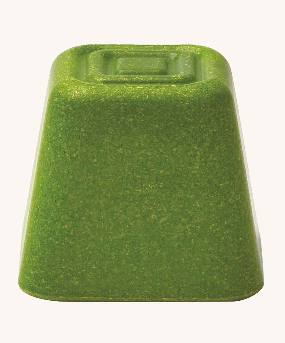 The green block from the PlanToys Creative Sand Play set, with a textured top for sensory play