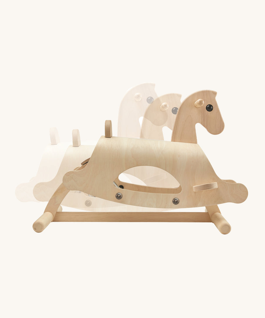 The PlanToys Lusitano Rocking Horse image showing the way the horse rocks back and forth, on a cream background