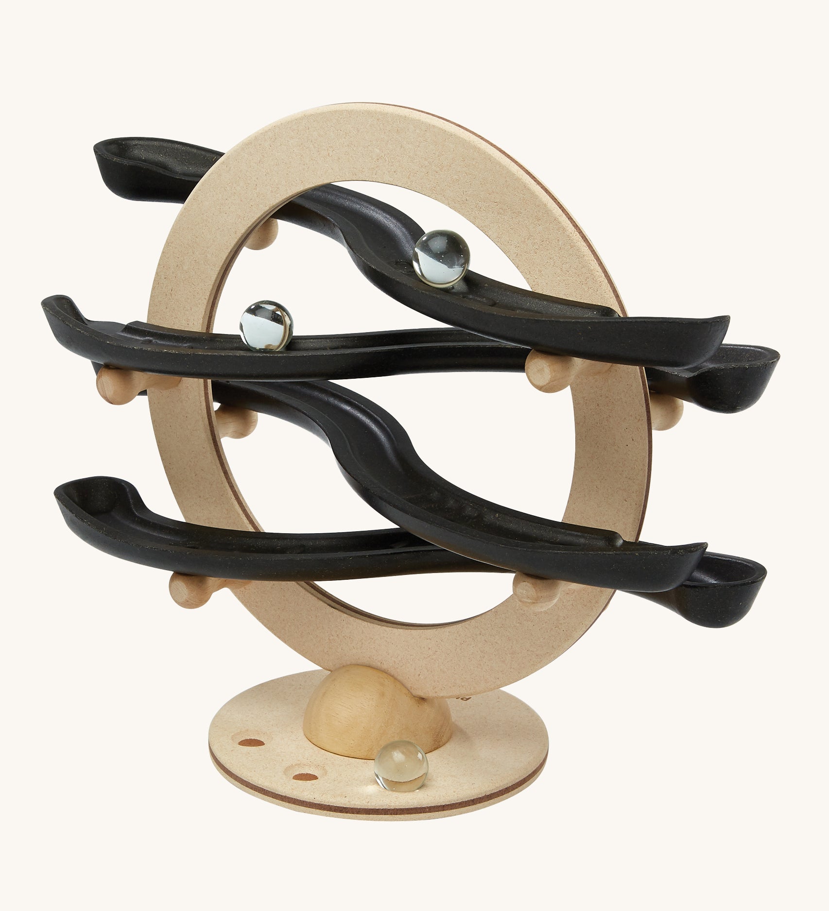 The PlanToys Curvy Click Clack game is a wooden marble run toy with a circle base and 4 wobbly tracks all made from PlanWood. The image shows marbles going down the track on a cream background