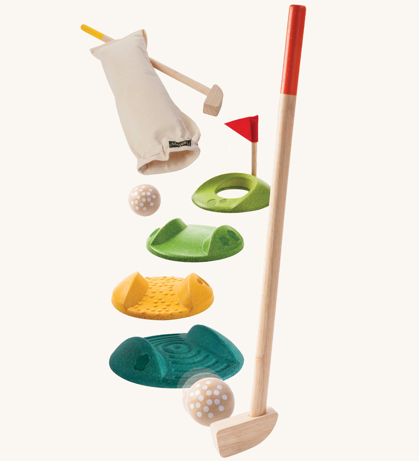 The PlanToys Mini Golf Game is a fun and sensory set, which Includes 2 wooden kids-sized golf clubs, 3 challenge tracks, 2 balls, 1 hole and a handy bag. Each track piece has a different texture on the top. The image is on a cream backgorund