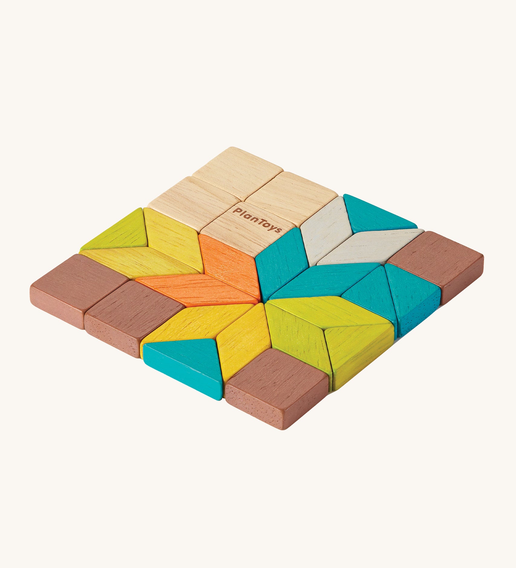 PlanToys Mini Mosaic Blocks in different shapes, sizes and colours, on a cream background. The mosaic tiles are in natural wood, blue, orange, green, yellow, brown and grey. The tiles are in the shapes of squares, triangles and rhombus