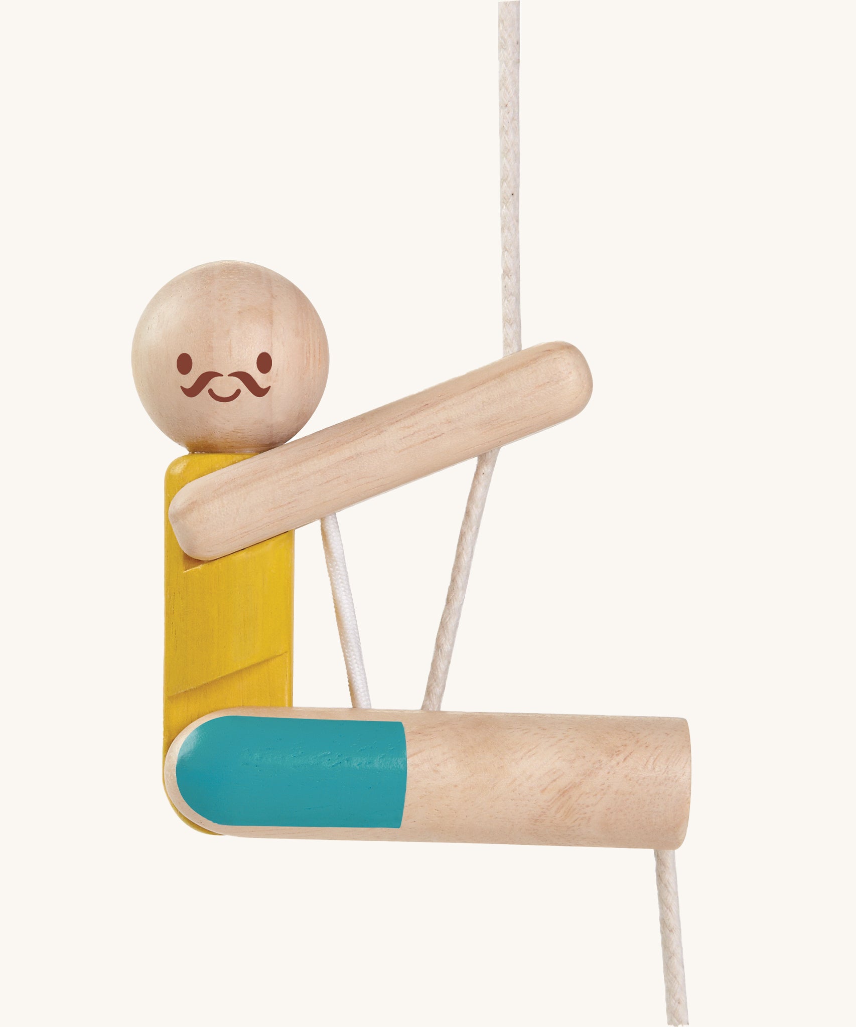 A closer look at the PlanToys Rope Climbing Acrobat. The figure has a happy, smiling face and mustache , a yellow painted top and blue painted shorts. The PlanToys paint is natural and safe. The image is on a cream background.