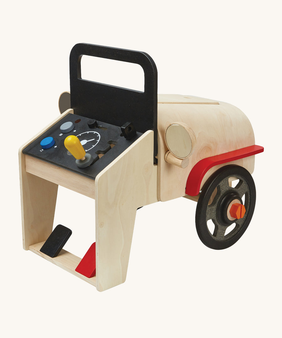 A view of the side section, showing a wooden car mirror on the PlanToys Motor Mechanic