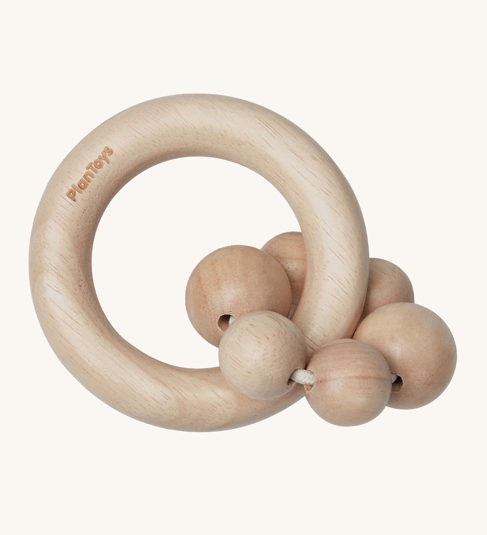 PlanToys Natural Wooden Beads Rattle is a beautifully crafted, wooden baby rattle that is perfect for teething and sore gums. The rattle comes with a wooden ring, and attached to the ring natural wood beads. The image is on a cream background