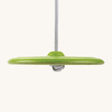 A side view of the Green PlanToys Saucer Disc Swing, showing the rope tied in a knot underneath