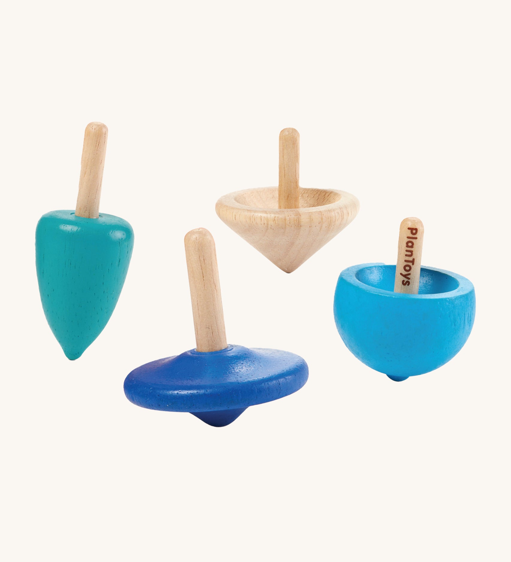 PlanToys Mini Spinning Tops Set of 4 spinning tops in blue shades and natural wood. The spinning tops come in various shapes and are on a cream background