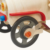 A closer look at the wheel on the PlanToys Motor Mechanic. The wrench is being used to show how to loosen and tighten the wheel bolt