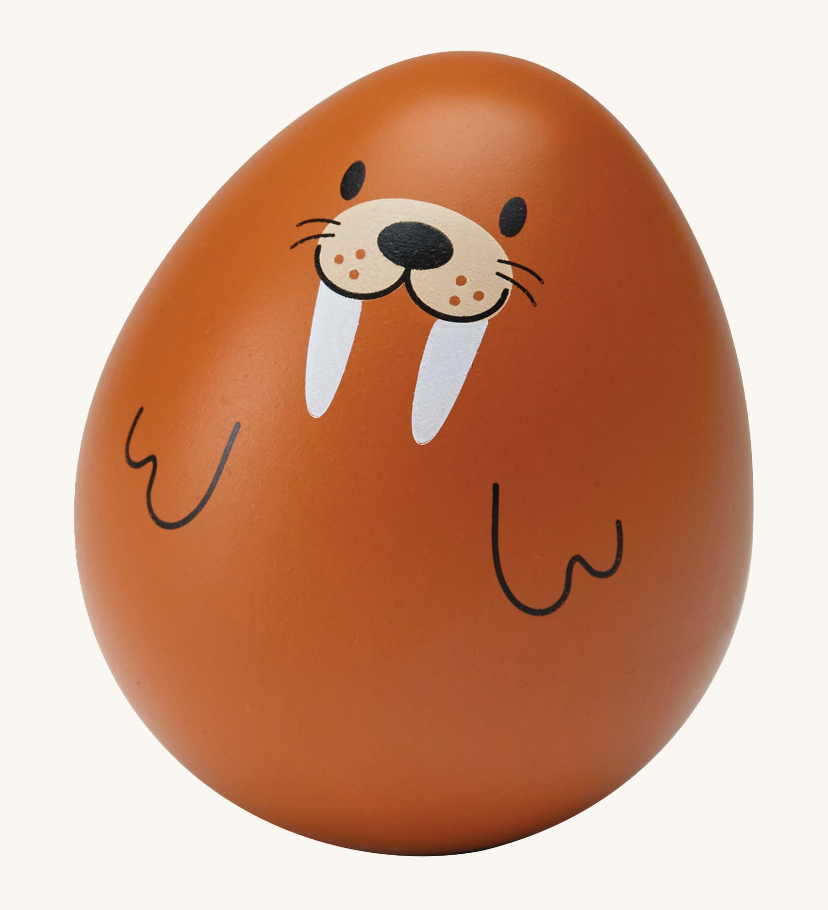 The PlanToys wooden wobbly walrus baby toy is an adorable wobble toy which babies and little ones will have so much fun playing with. The egg shaped wobble toy is in light brown with a cute walrus face and two black line flippers. The image is on a cream background