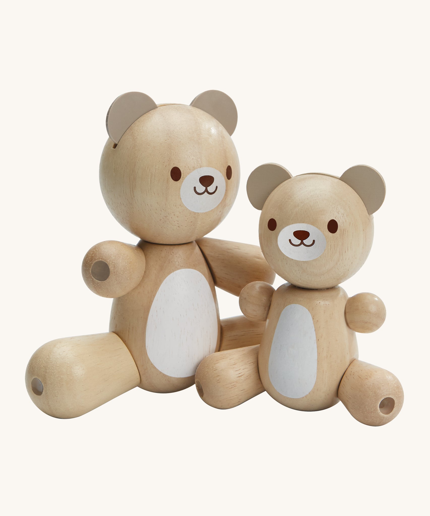 PlanToys Bear & Little Bear, is an adorable pair of bears made from wood, and perfect for babies and little ones. In this set is a big bear and a little bear, perfect for role play or play in general. Each bear has movable arms and legs, a white patch on their tummy and a happy, smiling face. The image is on a cream background