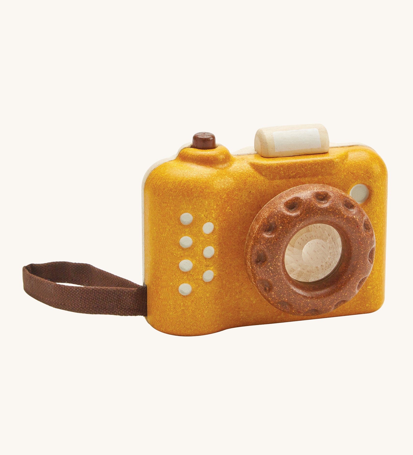 This PlanToys classic wooden toy is perfect for little ones and is in a mustard yellow colour with brown accents. The kaleidoscope in the lens can be rotated making multiple images that spin around. The pretend shutter button on the top can be pressed and there's a handy wrist strap just like the real thing. The image is on a cream background