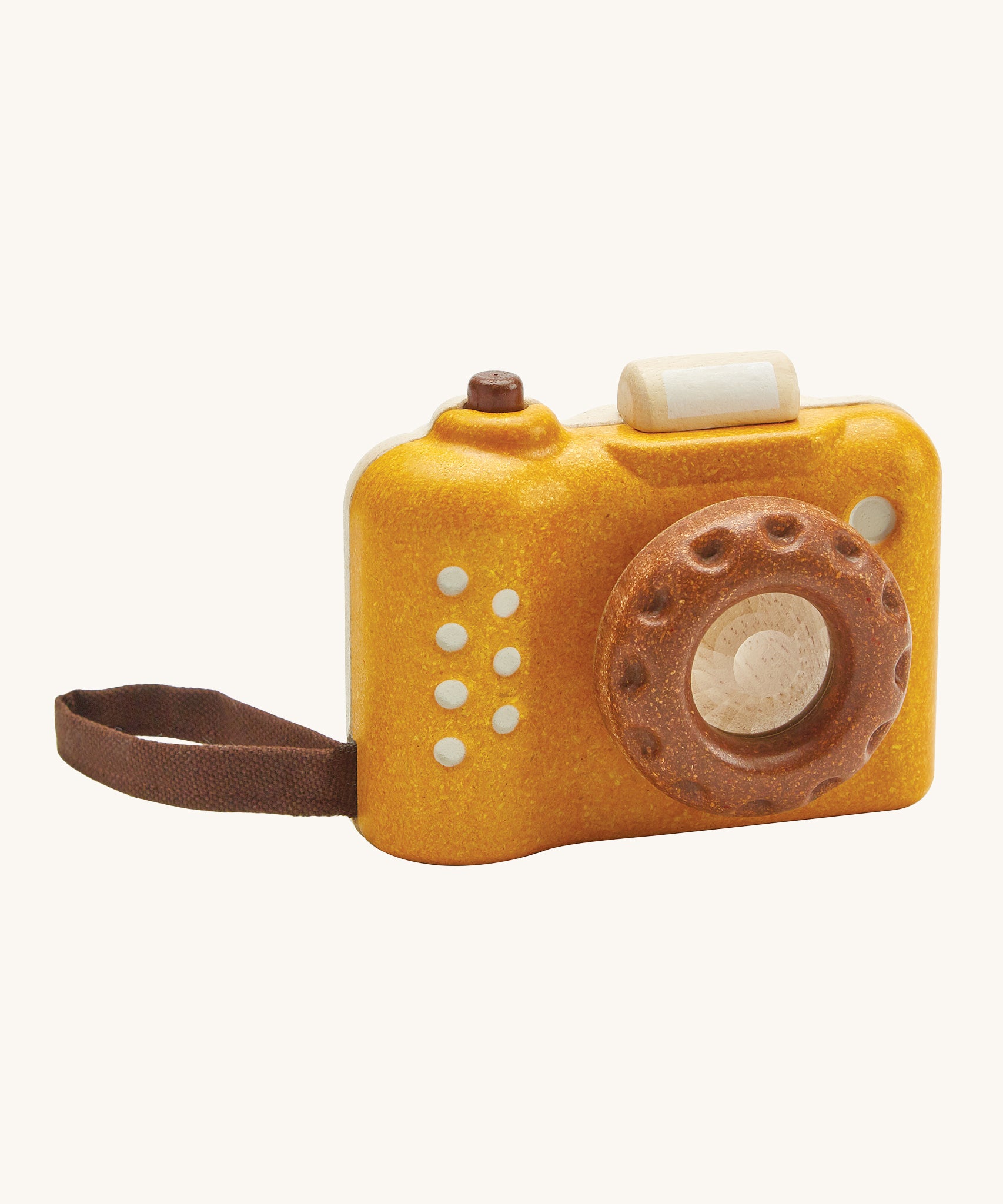 This PlanToys classic wooden toy is perfect for little ones and is in a mustard yellow colour with brown accents. The kaleidoscope in the lens can be rotated making multiple images that spin around. The pretend shutter button on the top can be pressed and there's a handy wrist strap just like the real thing. The image is on a cream background