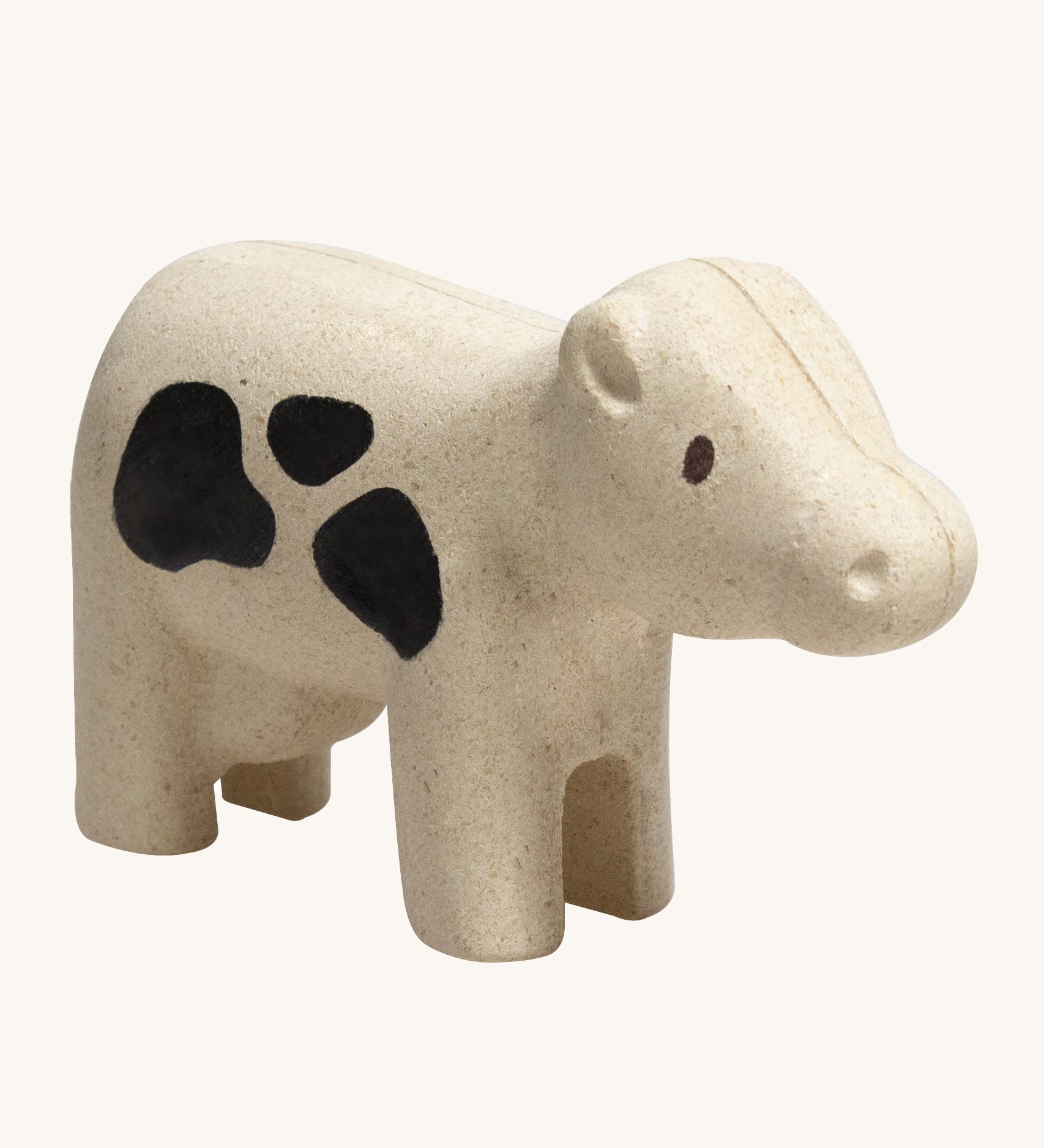 The PlanToys Cow is an adorable farm yard toy for little ones. Made from PlanWood, this cow is white with black spots, and is on a cream background