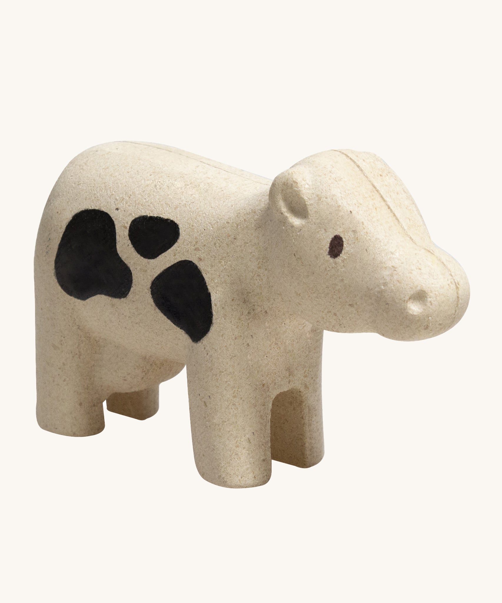 The PlanToys Cow is an adorable farm yard toy for little ones. Made from PlanWood, this cow is white with black spots, and is on a cream background