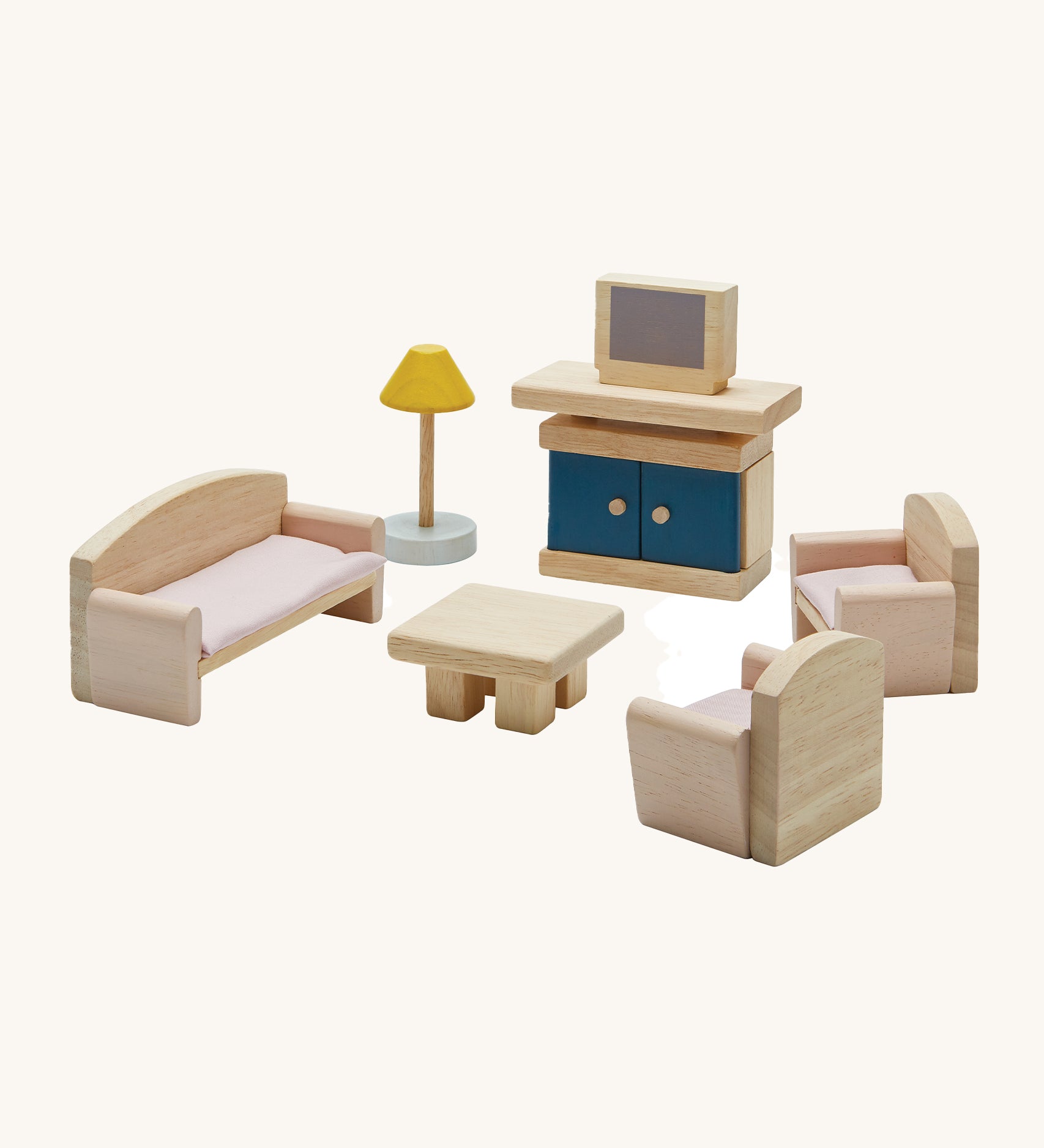 Plan Toys Living Room Dolls House Furniture Set, featuring Wooden chairs, a sofa, a coffee table, a lamp and a TV with a TV unit. On a cream background