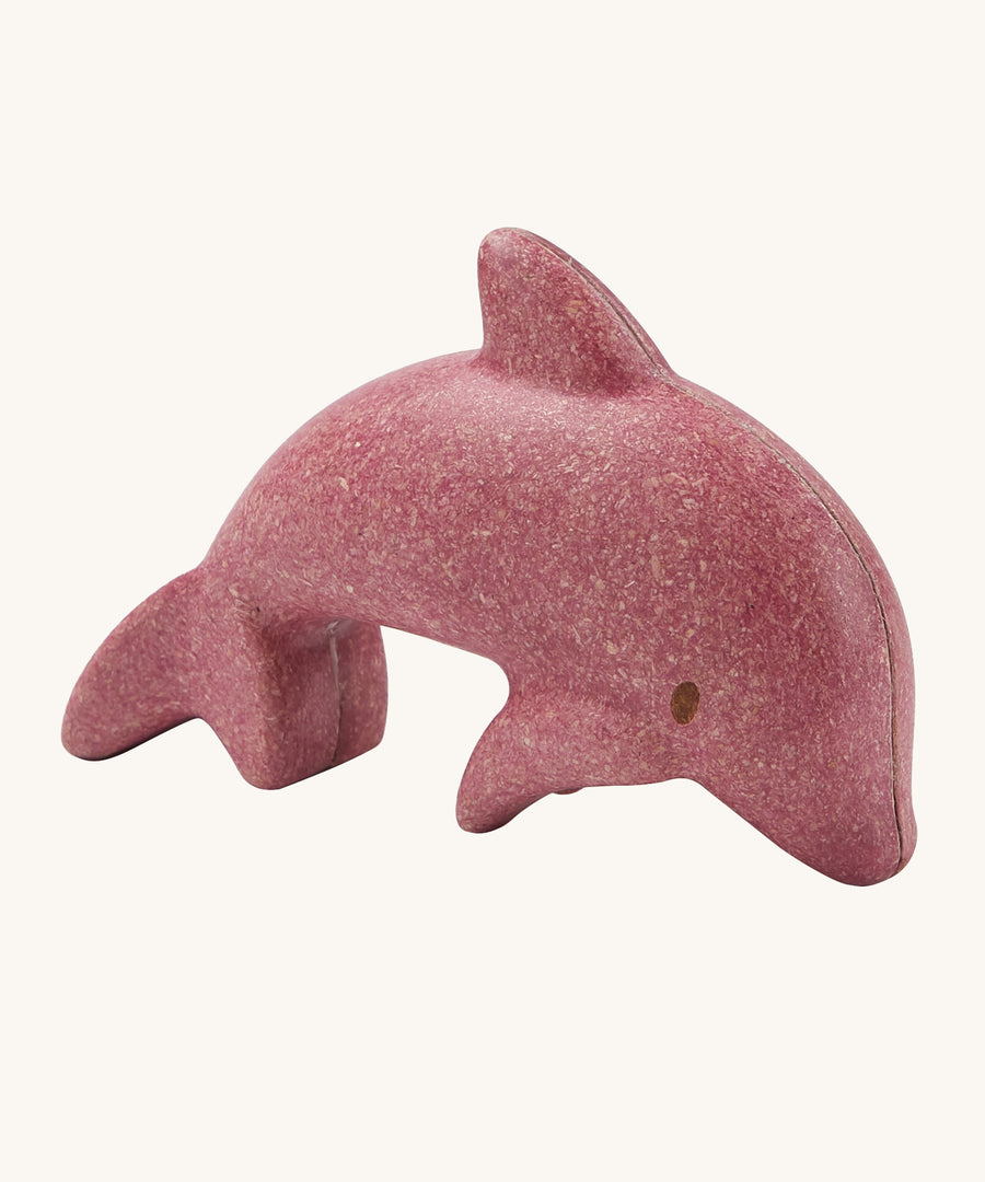 The PlanToys dolphin is an adorable sea life toy for little ones. Made from PlanWood, this dolphin is pink with brown eyes, and is on a cream background