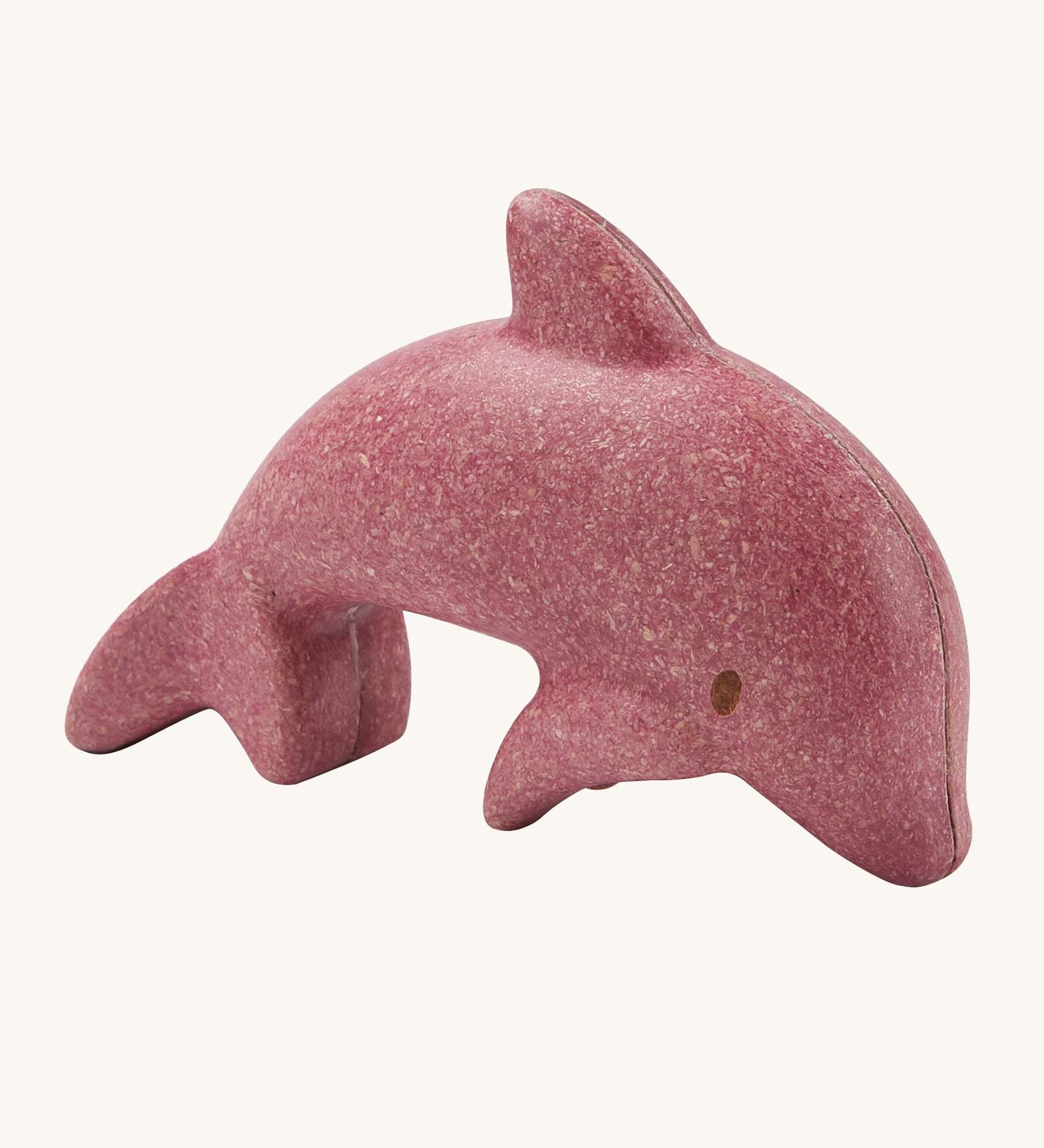 The PlanToys dolphin is an adorable sea life toy for little ones. Made from PlanWood, this dolphin is pink with brown eyes, and is on a cream background