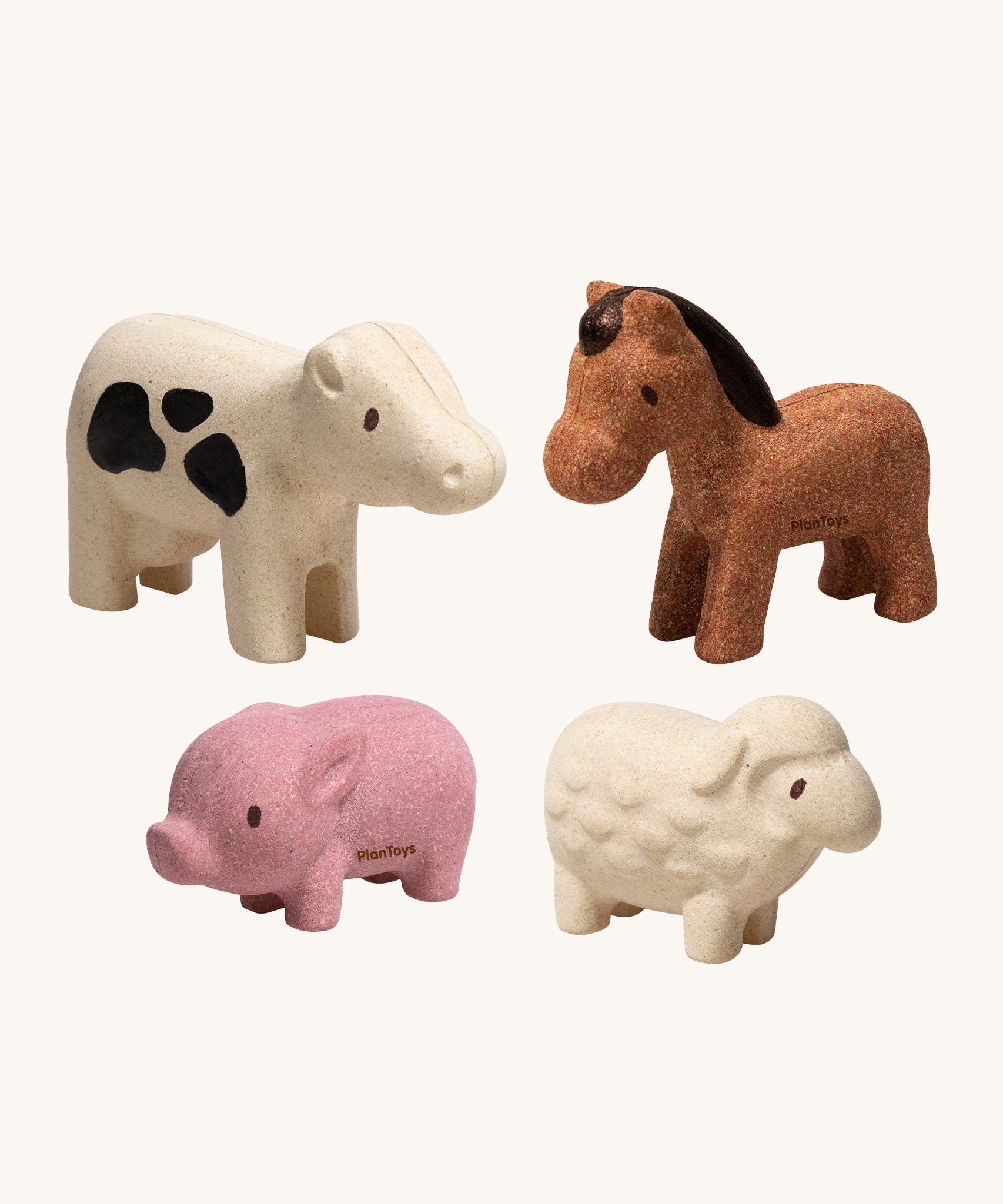 The PlanToys Farm Animals Set come with four adorable figures which include a pink pig, a white cow with black spots, a brown horse and a white sheep. The image is on a cream background